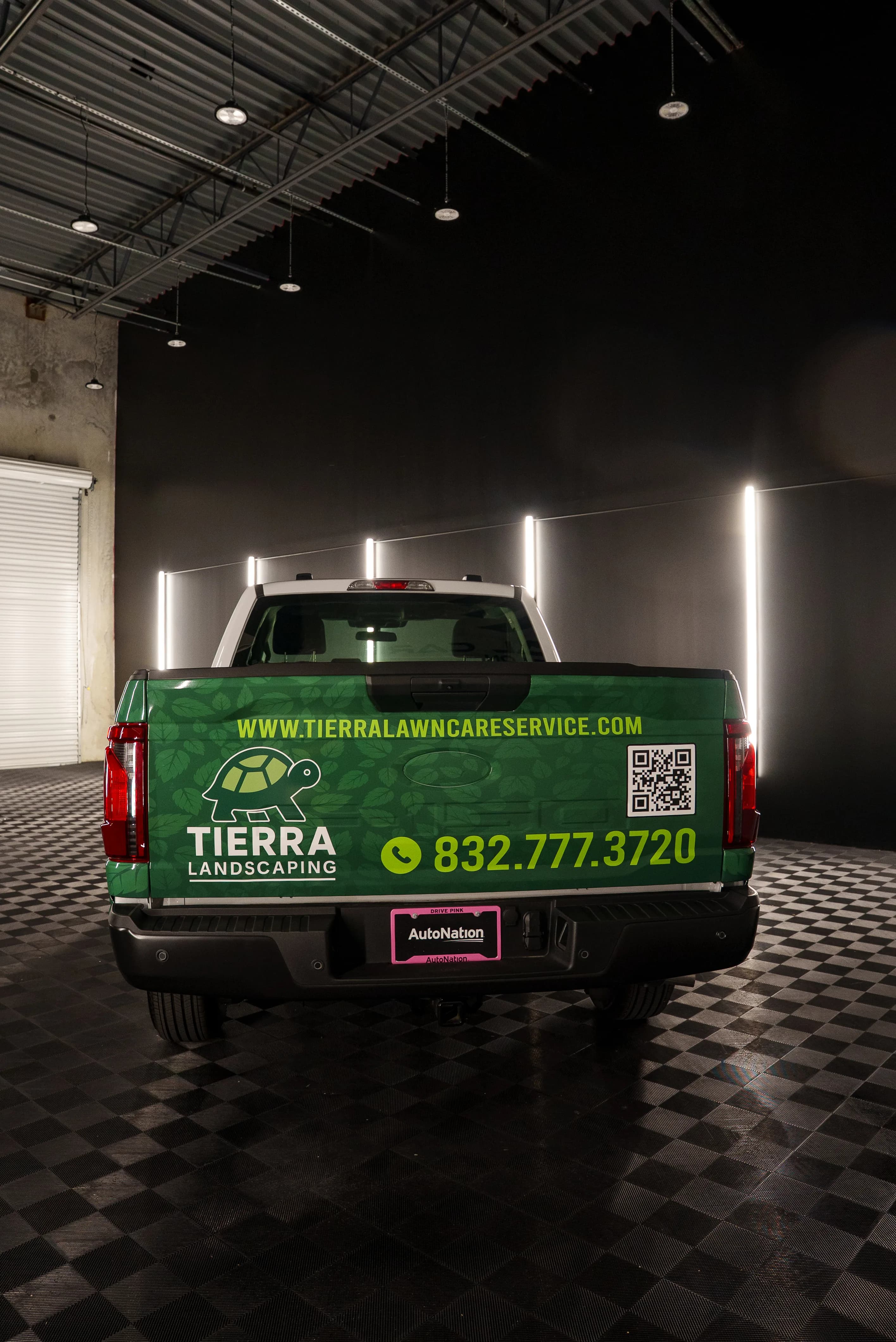 Tierra Landscaping truck tailgate with branding and contact info