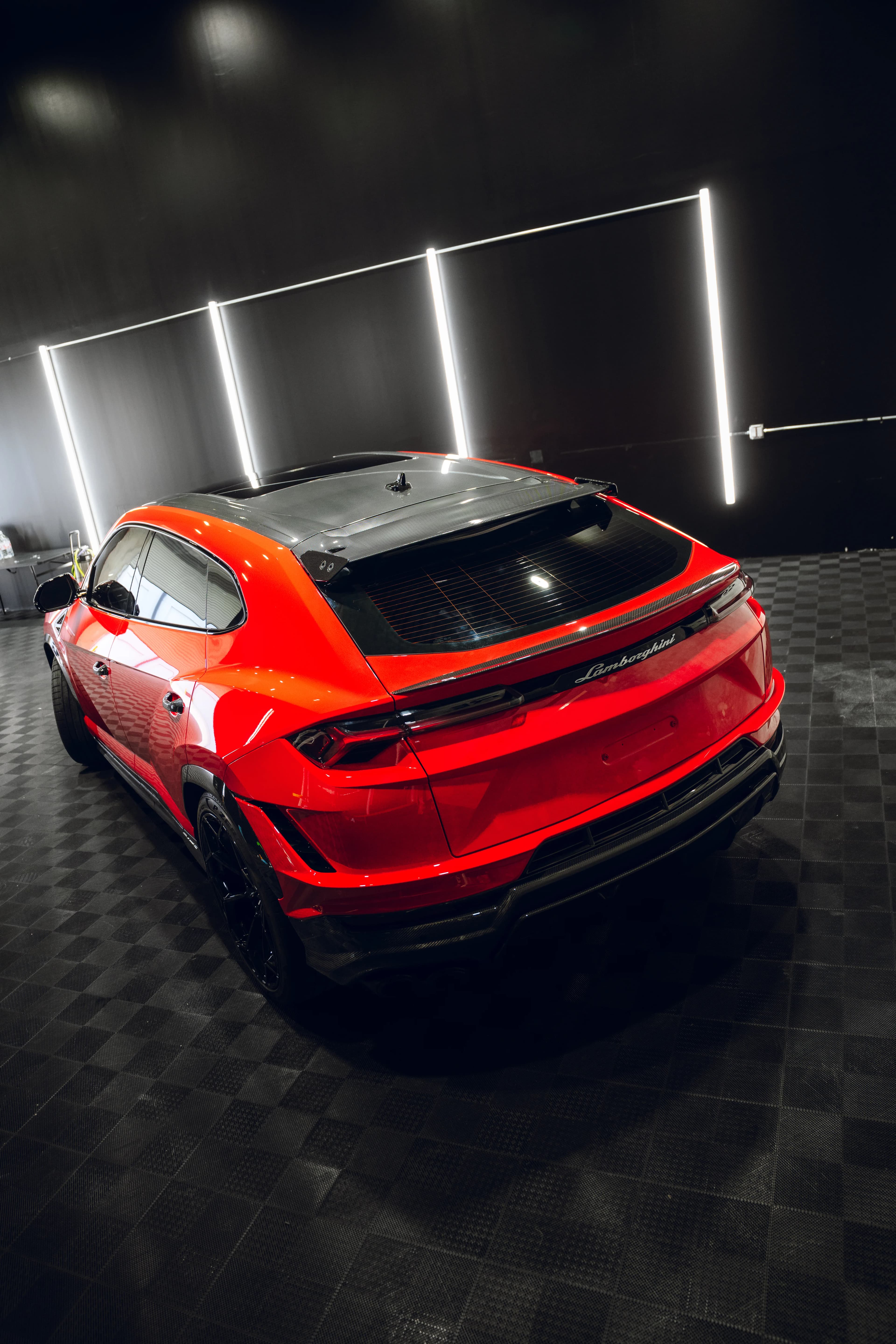 Red Lamborghini with custom vehicle wrap, side profile